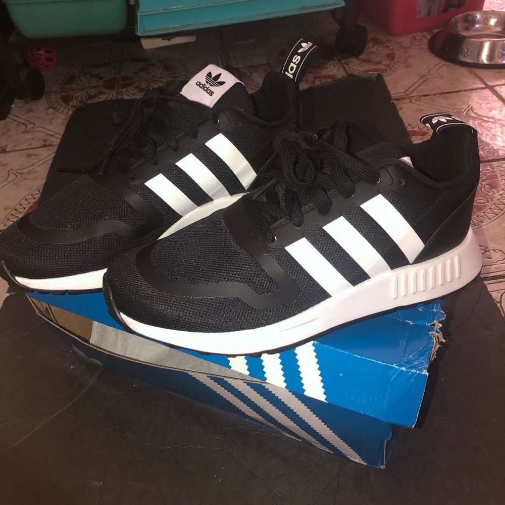Black and white Adidas sneakers
